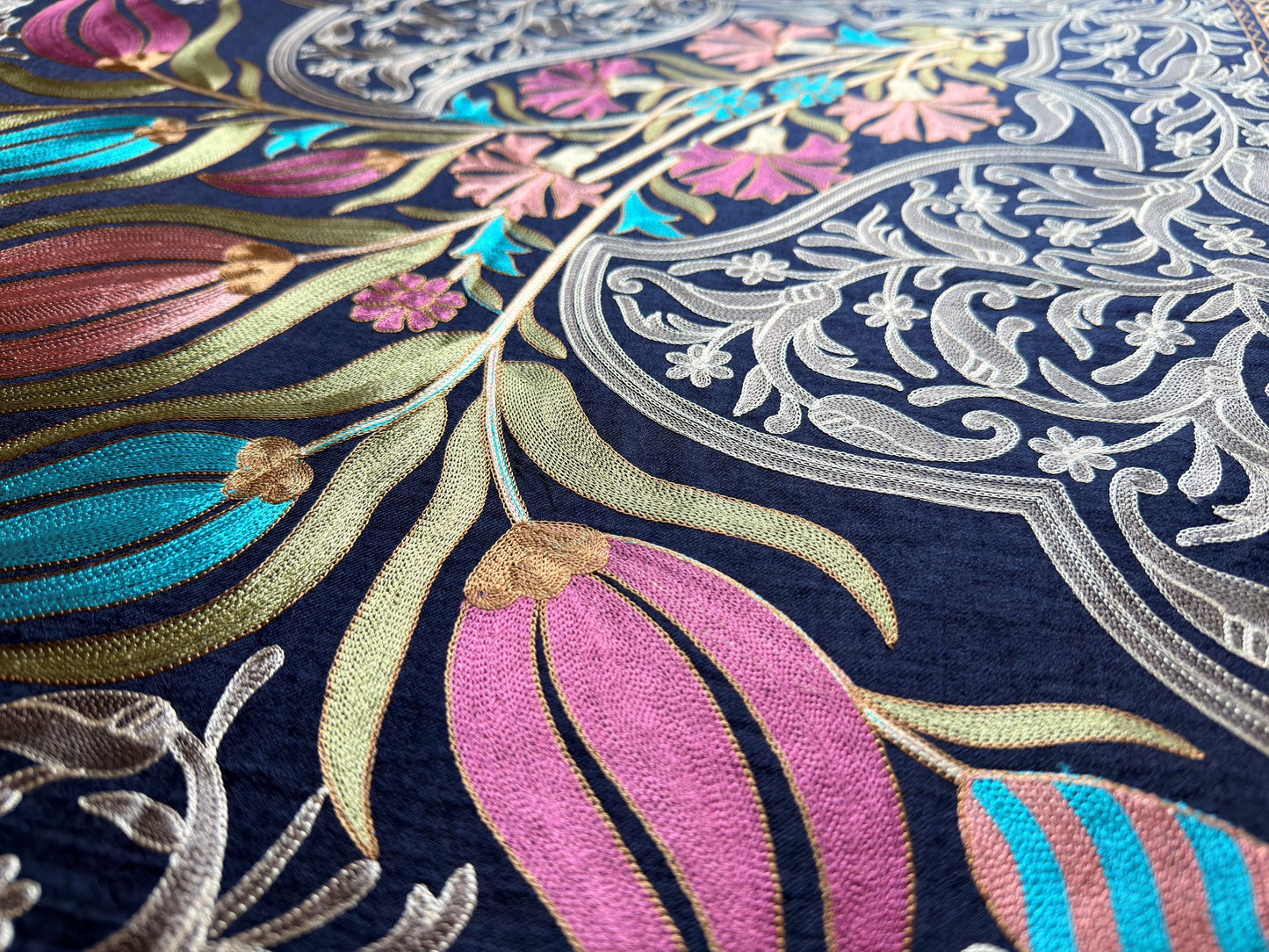 Noori Couture handwoven Montana Blue wool shawl featuring intricate multi-colored silk floral and vine embroidery.