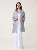 Noori Couture bronze Kashmiri wool shawl with delicate Valentino lace trim draped over a model in a white dress.