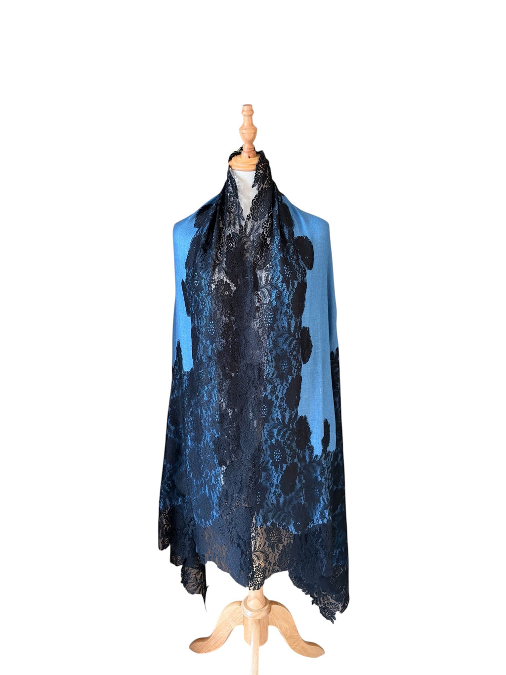 Noori Couture blue and black Kashmiri wool shawl featuring delicate Valentino lace trim on a wooden mannequin