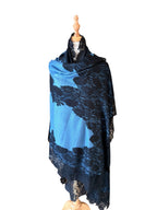 Noori Couture blue and black Kashmiri wool shawl featuring delicate Valentino lace trim on a mannequin