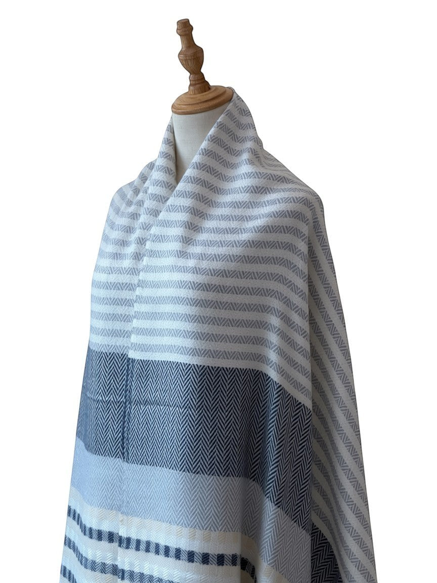 Noori Couture cashmere scarf with grey, white, and pale yellow stripes and herringbone pattern.