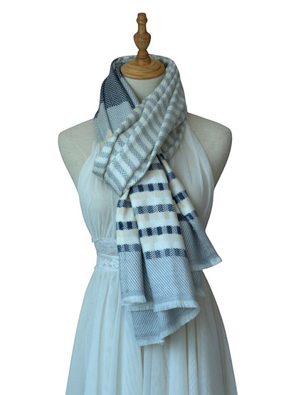 Noori Couture cashmere scarf with grey, white, and pale yellow stripes and herringbone pattern. Versatile for multiple styling options.