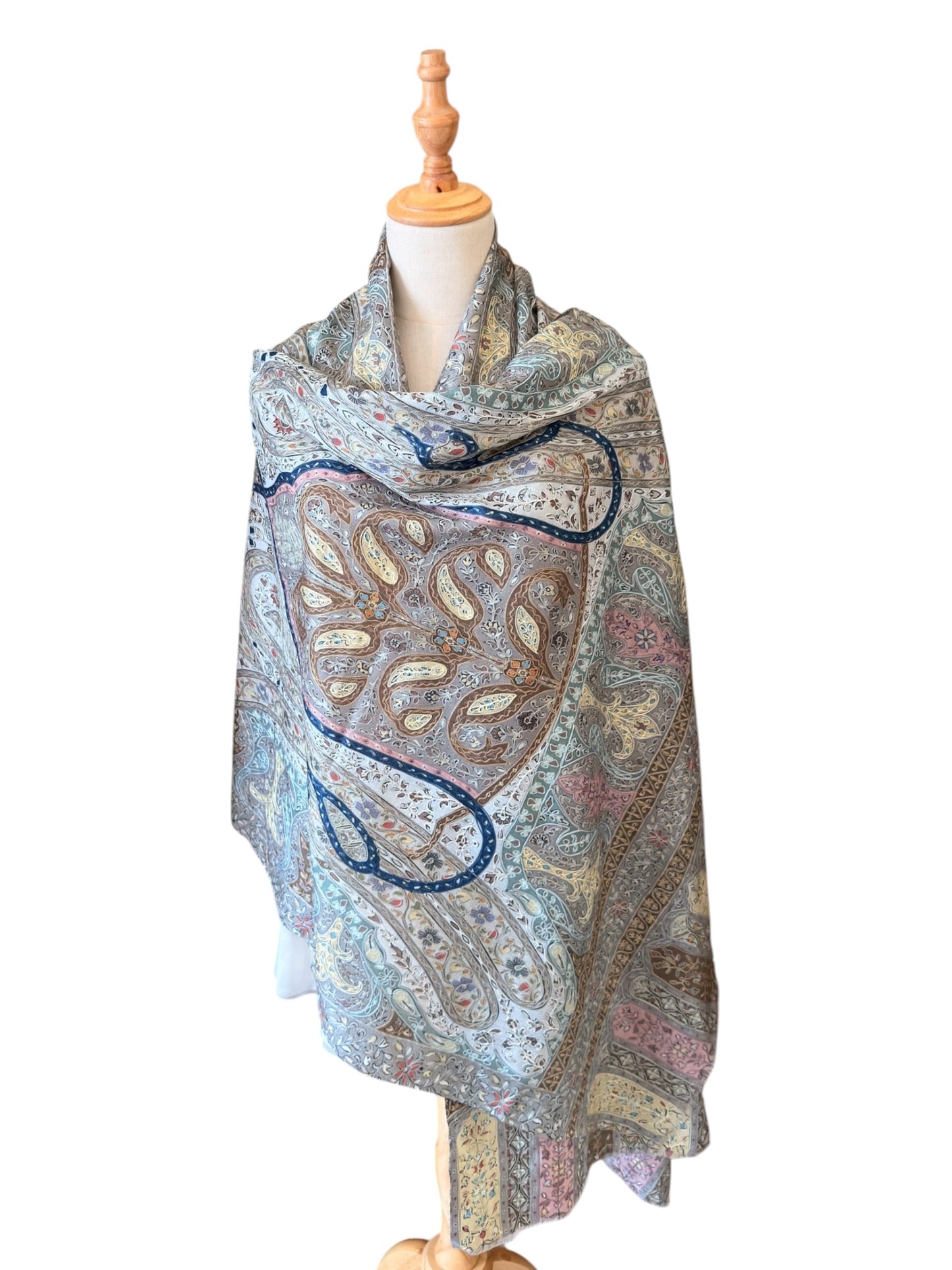 Noori Couture handwoven aqua merino wool shawl featuring intricate hand-painted Kalamkari motifs and silk embroidery.