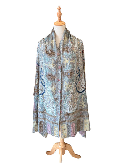 Noori Couture handwoven aqua merino wool and silk shawl featuring intricate hand-painted Kalamkari paisley motifs.