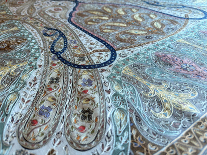 Noori Couture aqua merino wool shawl with intricate hand-painted Kalamkari paisley motifs and silk embroidery detail.