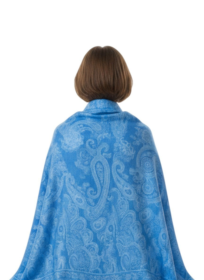Noori Couture aquamarine blue pure silk shawl with paisley pattern and fringe detail. Model from behind.