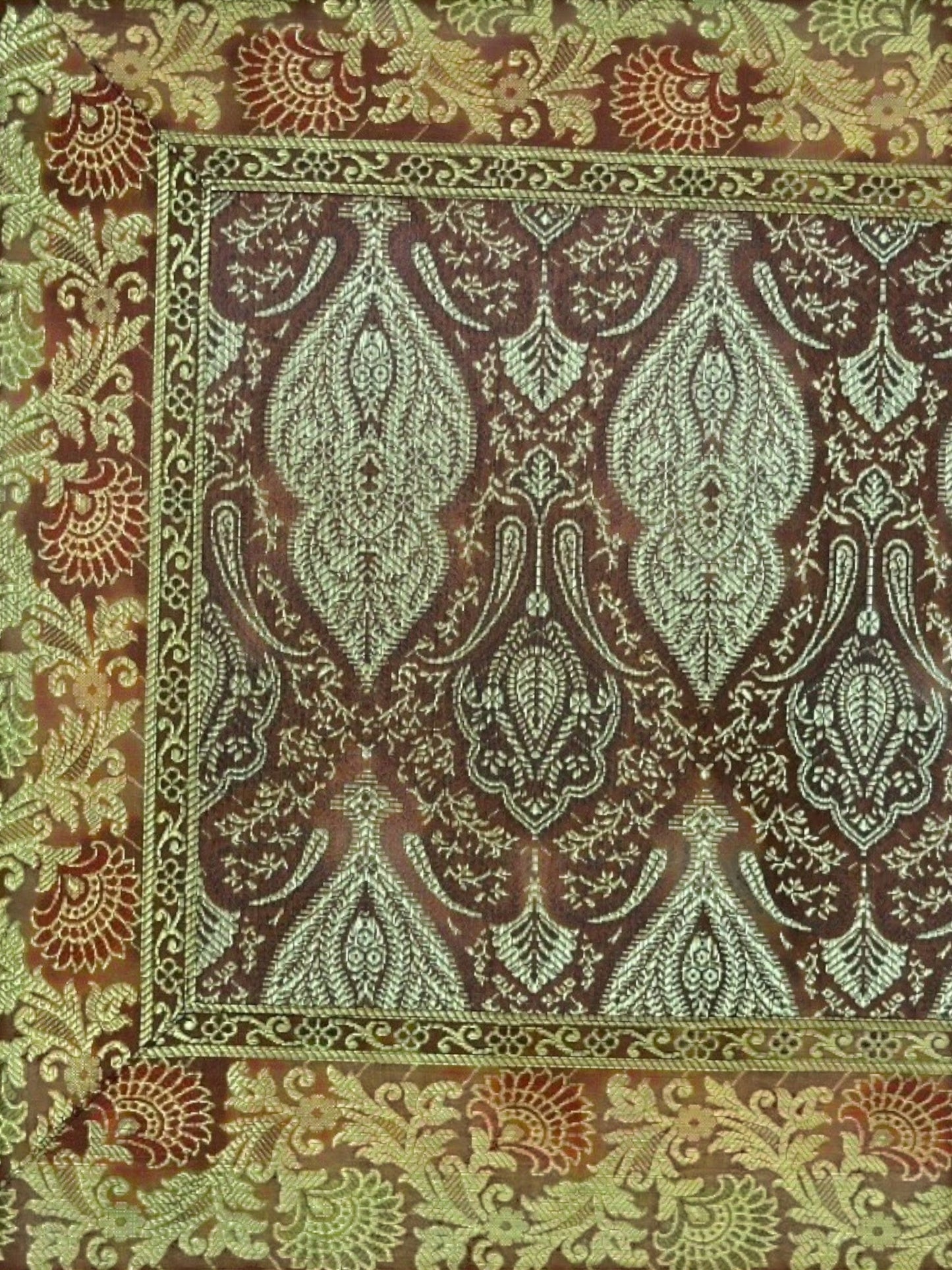 Noori Couture Banarasi brocade cushion cover with intricate zari detailing in brown, green, and red.