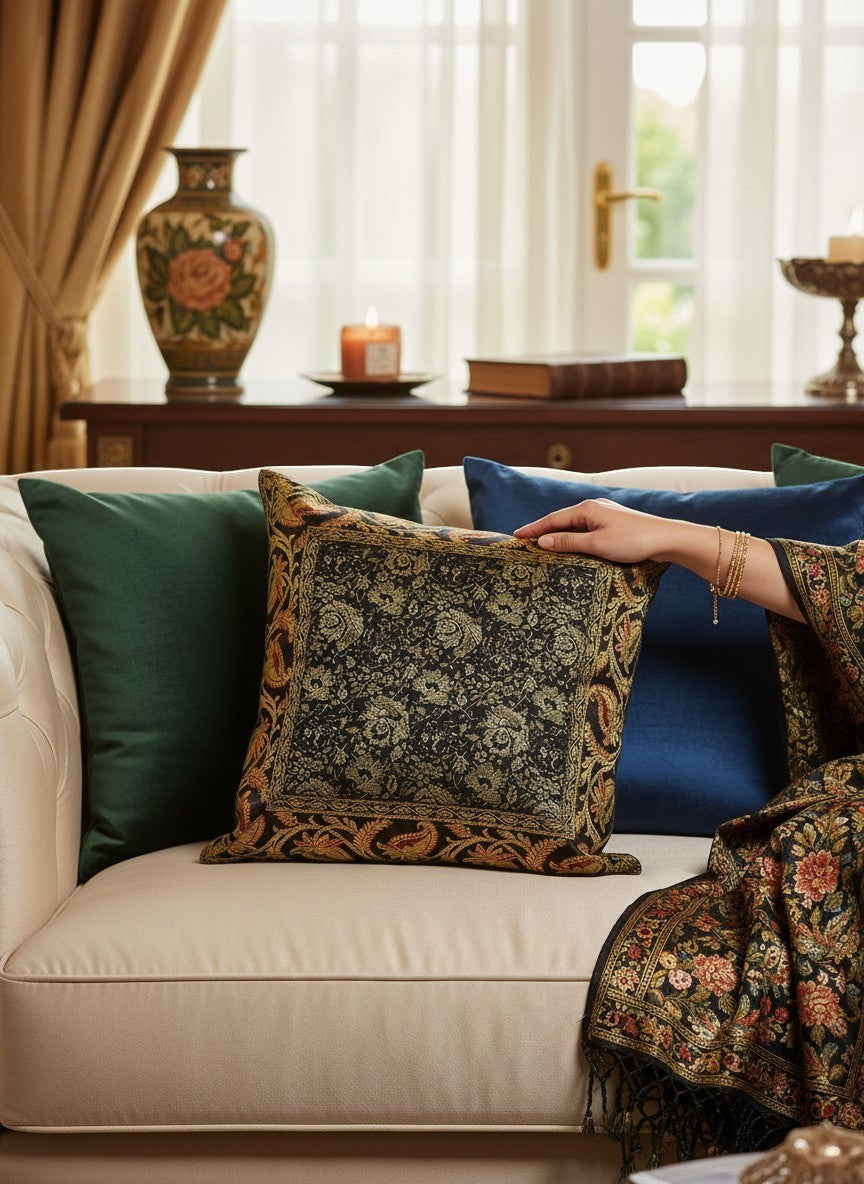 Noori Couture Banarasi brocade cushion cover with intricate zari detailing and floral motifs in black and gold.