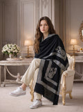 Noori Couture black handwoven Hashidar shawl in fine Kashmir wool with intricate silver embroidery worn by a woman.