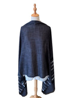 Noori Couture black handwoven modal and bamboo silk shawl with subtle stripe pattern on a mannequin