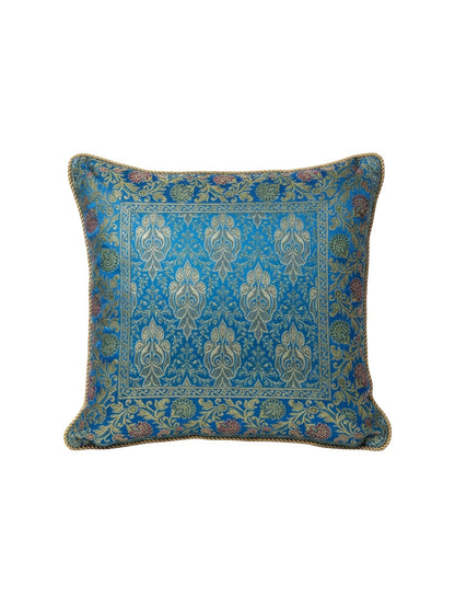 Noori Couture blue and gold ornate floral patterned cushion cover made of textured fabric.