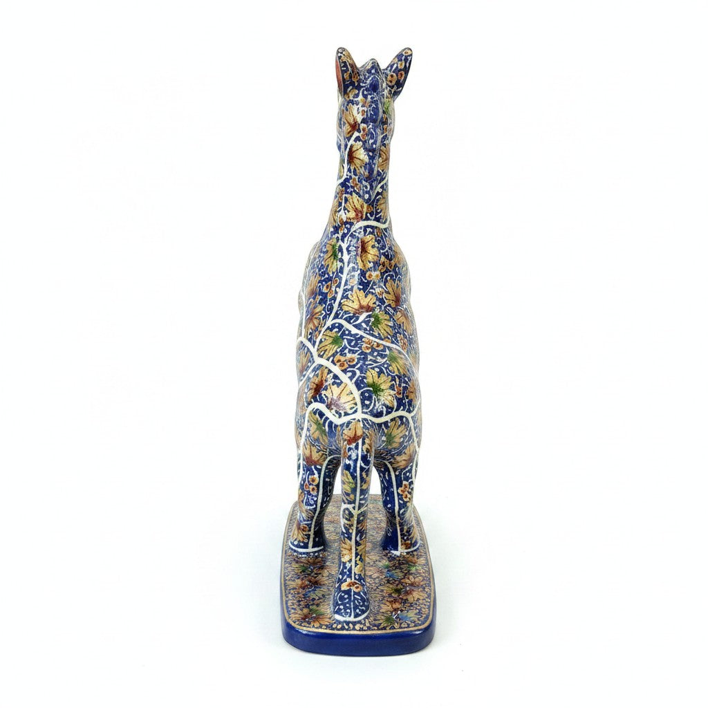 Noori Couture hand-painted blue decorative horse sculpture with gold floral patterns, on a blue base.