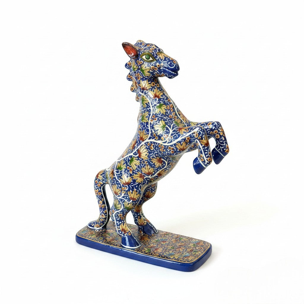 Noori Couture hand-painted blue horse sculpture with gold floral patterns, rearing on hind legs.