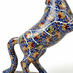Noori Couture hand-painted blue horse sculpture with gold floral patterns, rearing pose.