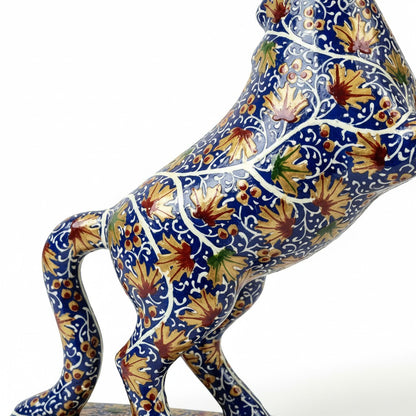 Noori Couture hand-painted blue horse sculpture with gold floral patterns, rearing pose.
