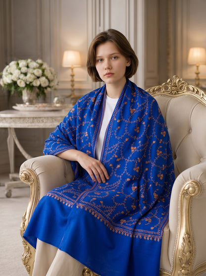 Noori Couture royal blue handwoven shawl with intricate Sozni jali embroidery and floral motifs. Features a decorative border.