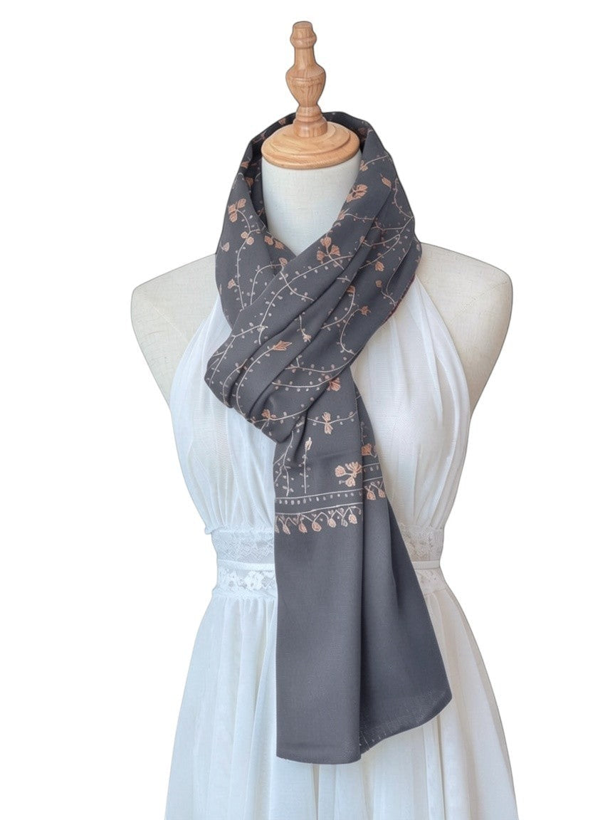 Noori Couture blue handwoven shawl with intricate gold Sozni Jali embroidery, displayed on a mannequin.
