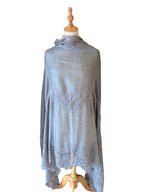 Noori Couture bronze Kashmiri wool shawl featuring delicate Valentino lace trim draped on a mannequin