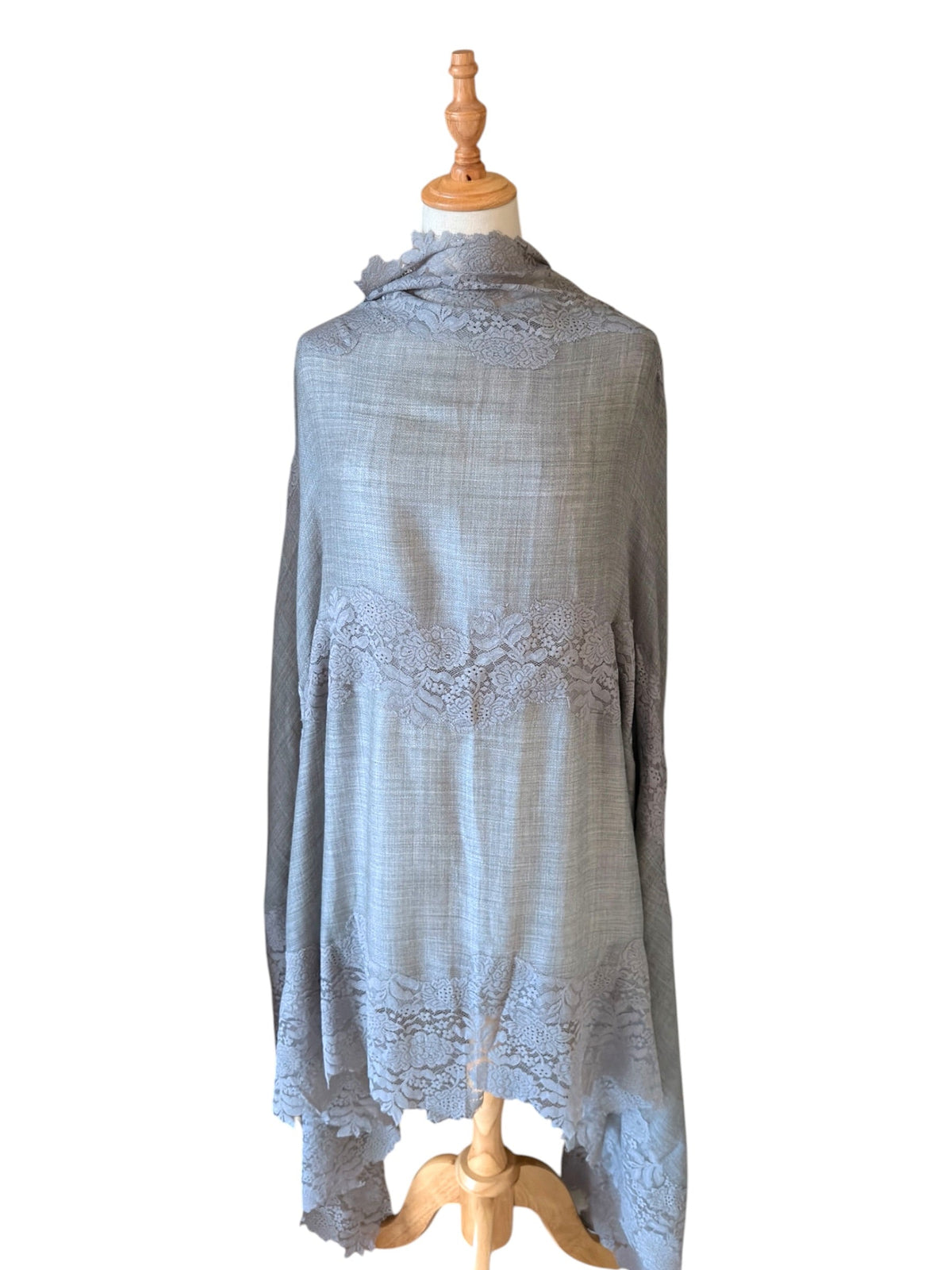 Noori Couture bronze Kashmiri wool shawl featuring delicate Valentino lace trim draped on a mannequin