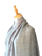 Noori Couture bronze Kashmiri wool shawl featuring delicate Valentino lace trim draped on a mannequin