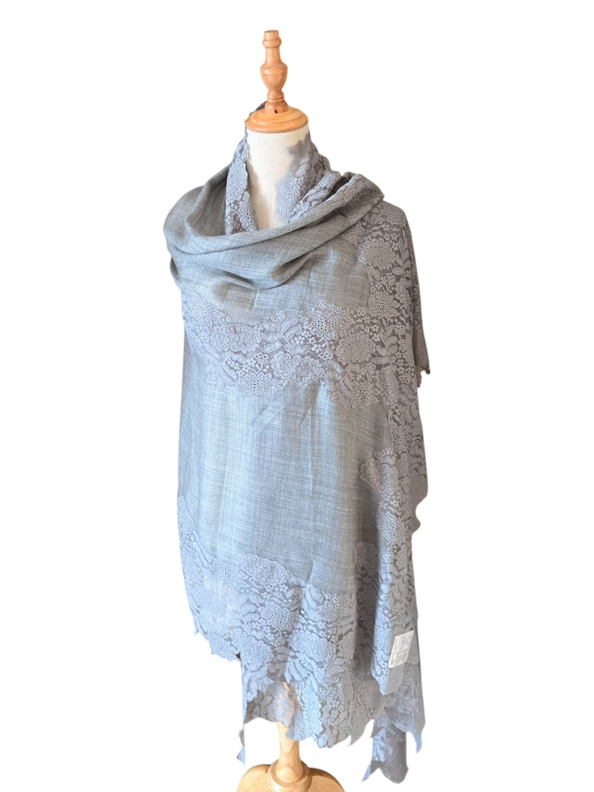 Noori Couture bronze Kashmiri wool shawl featuring delicate Valentino lace trim draped on a mannequin