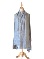 Noori Couture bronze Kashmiri wool shawl featuring delicate Valentino lace trim draped on a mannequin