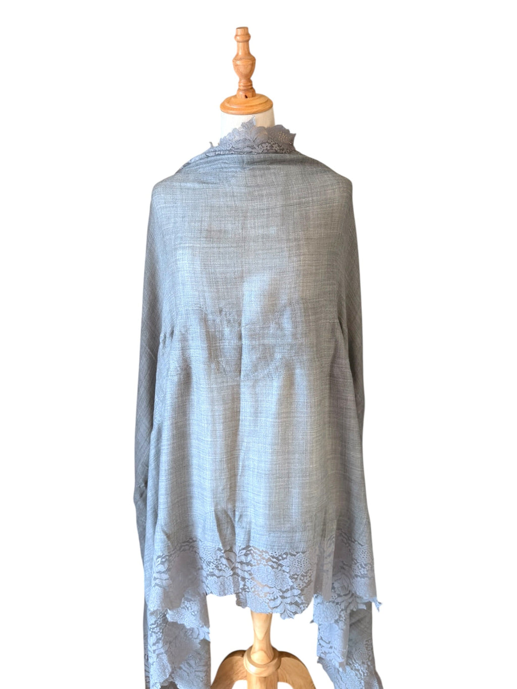Noori Couture bronze Kashmiri wool shawl featuring delicate Valentino lace trim draped on a mannequin