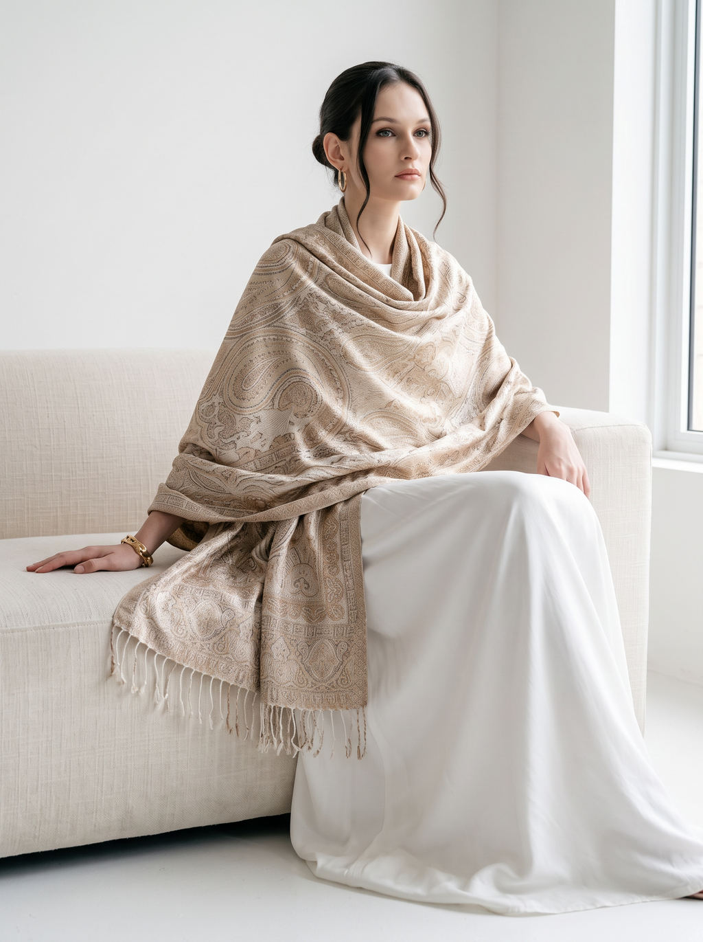 A model wearing a Noori Couture handwoven coffee-coloured pure mulberry silk shawl with intricate paisley patterns.