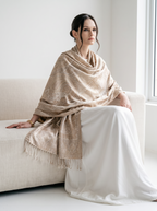 A model wearing a Noori Couture handwoven coffee-coloured pure mulberry silk shawl with intricate paisley patterns.