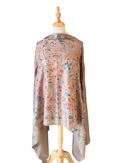 Noori Couture cream wool shawl with intricate multi-colored silk floral and paisley embroidery on a mannequin
