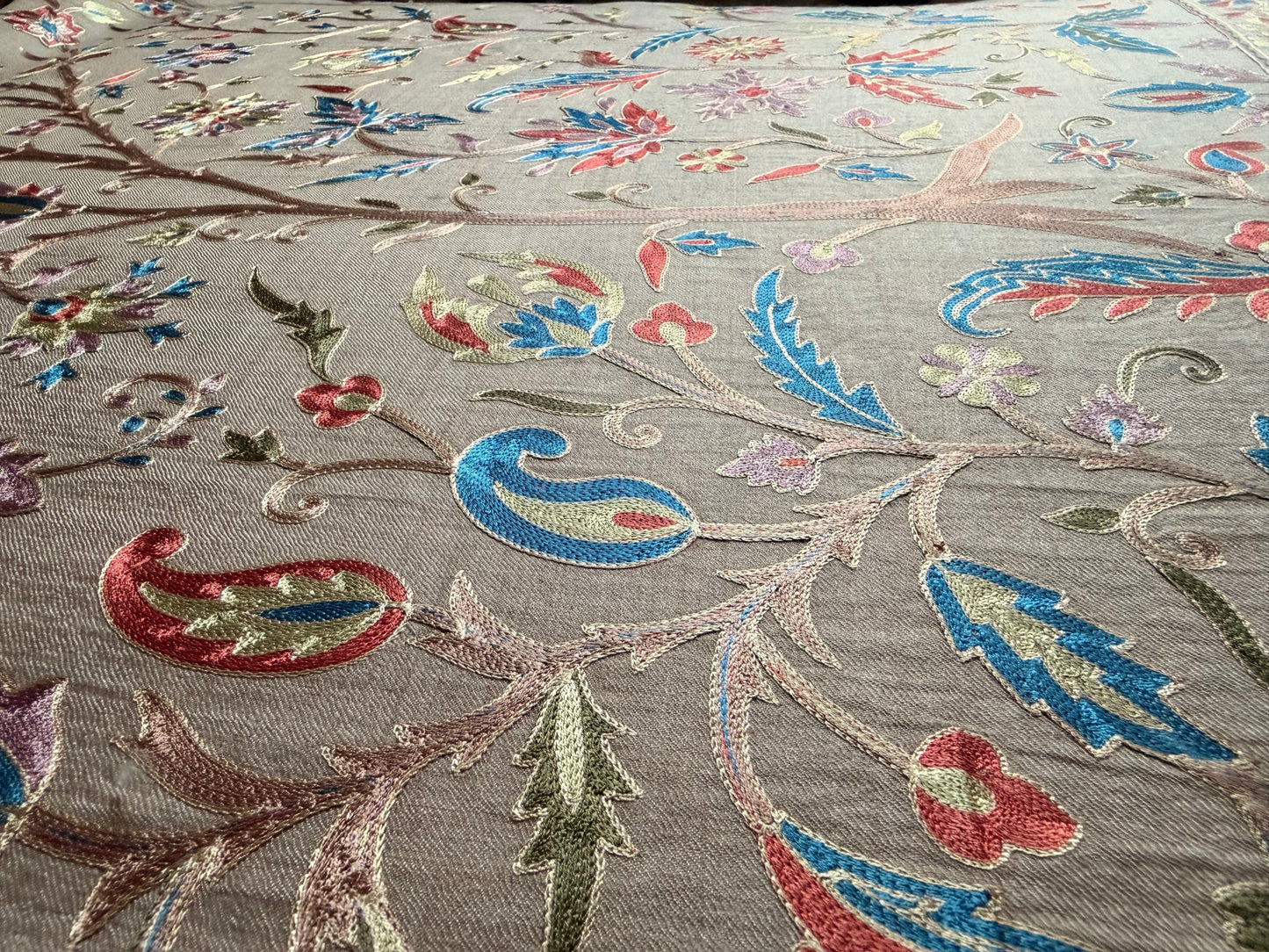 Noori Couture handwoven cream wool shawl with intricate multi-colored silk floral and paisley Jamawar embroidery.