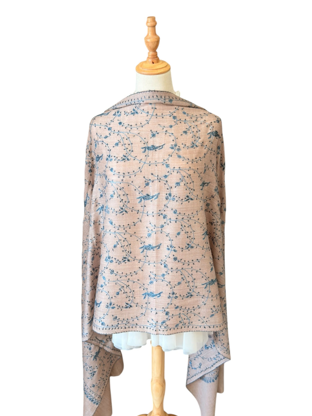 Noori Couture cream Merino wool shawl featuring intricate blue Jali Sozni hand-embroidery on a mannequin.