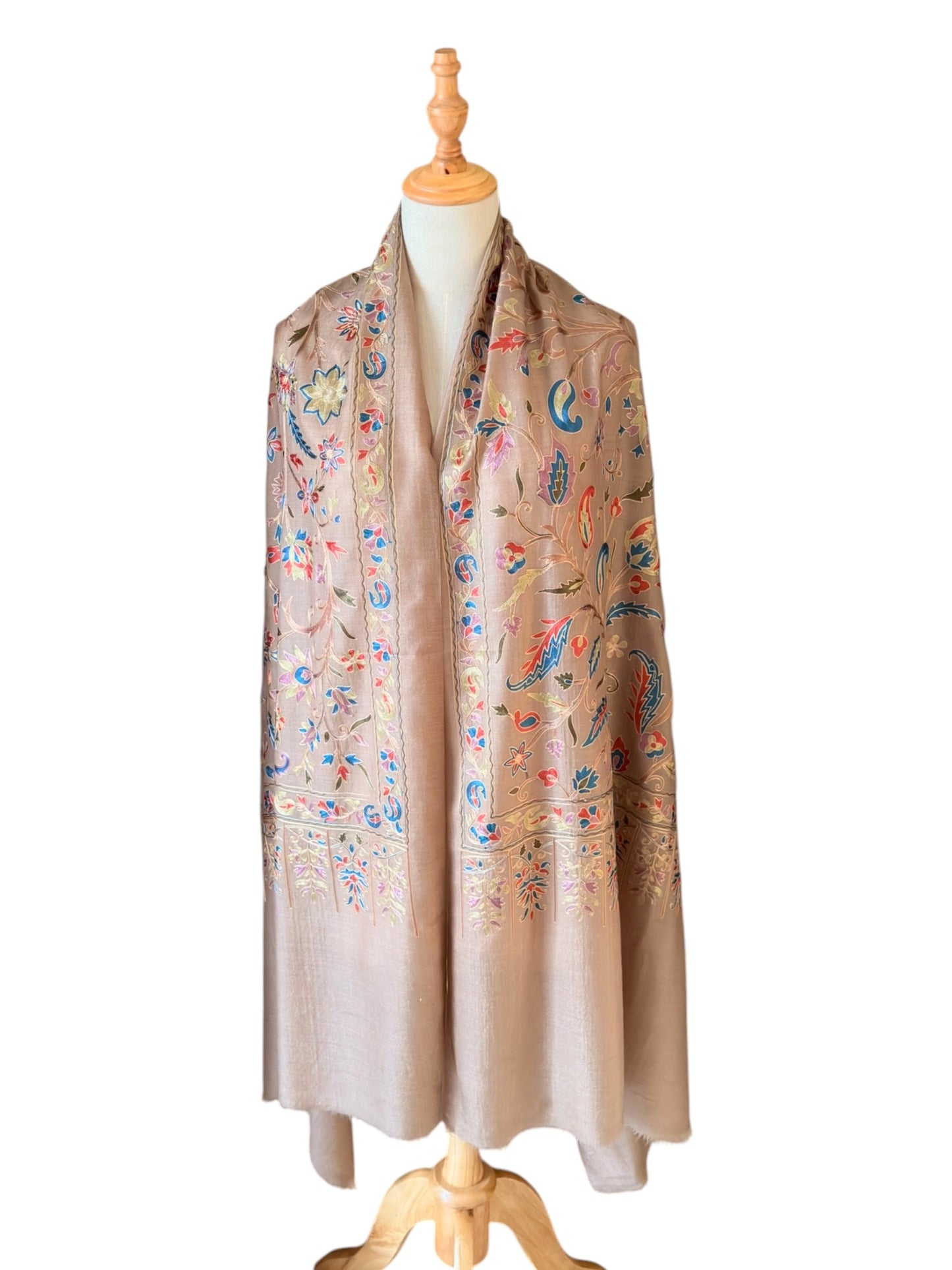Noori Couture cream wool shawl featuring intricate multi-colored silk floral and paisley embroidery on a mannequin
