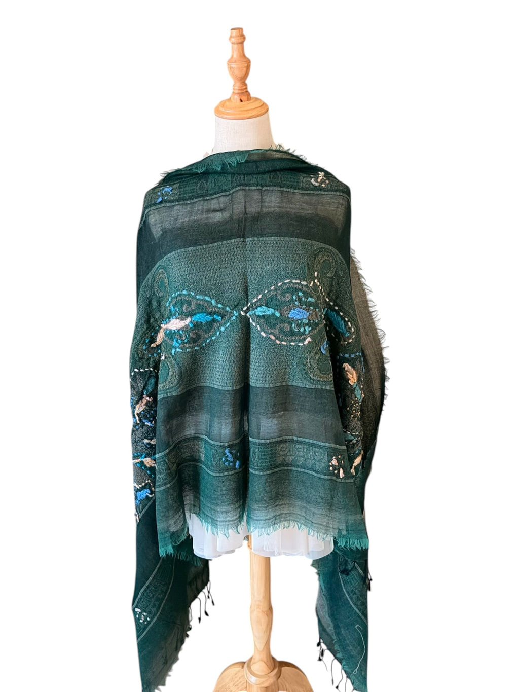Noori Couture black and green embroidered merino boil wool shawl with intricate hand-stitched detailing on a mannequin