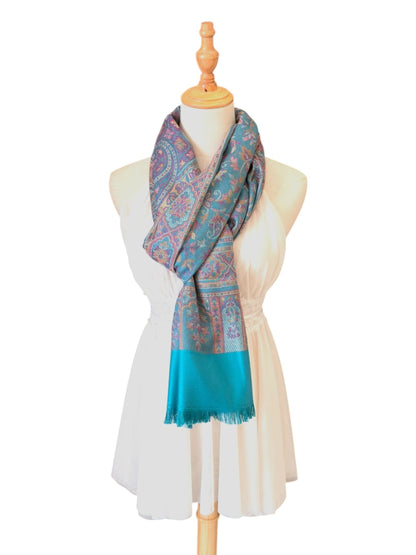 Noori Couture seaweed green pashmina shawl with intricate paisley patterns and delicate fringe on a mannequin