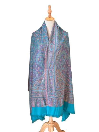 Noori Couture seaweed green pashmina shawl with intricate paisley patterns, teal and purple motifs, and fringe trim.