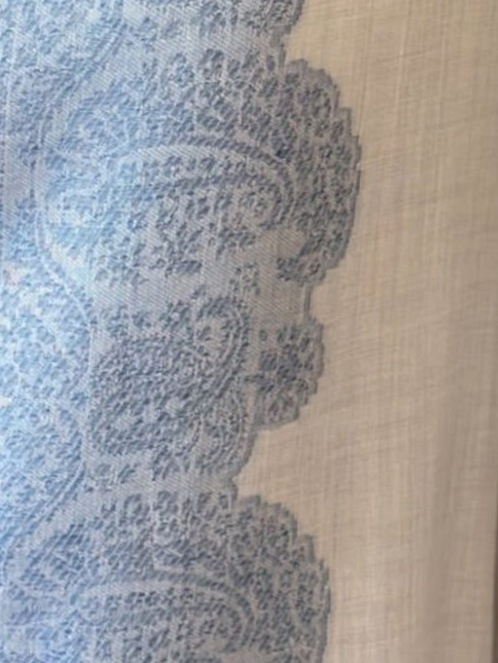 Noori Couture grey bamboo silk shawl featuring intricate blue paisley embroidery and a soft, fluid drape.