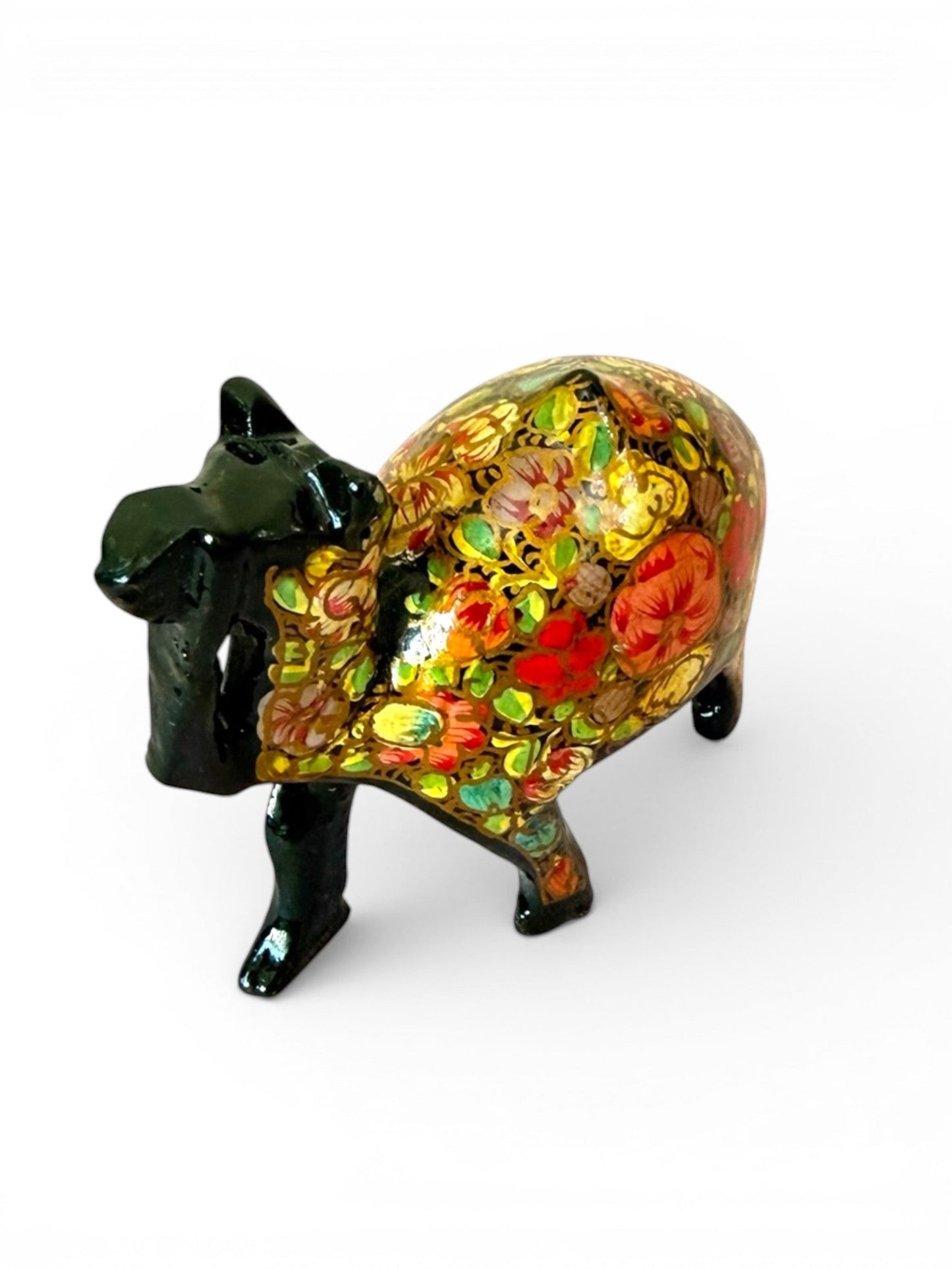 Noori Couture hand-painted black camel figurine with vibrant floral patterns and glossy finish.