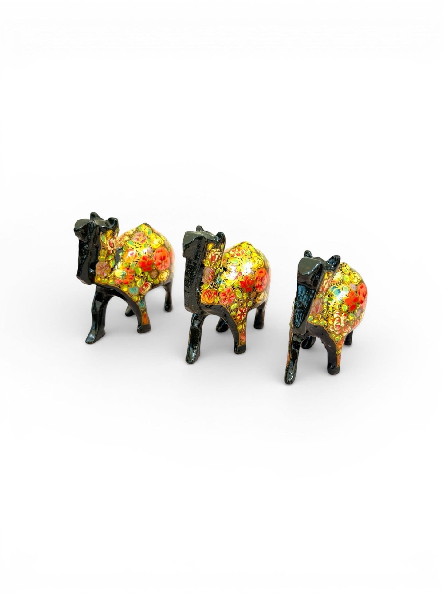 Noori Couture hand-painted camel figurines with vibrant floral patterns and glossy finish.