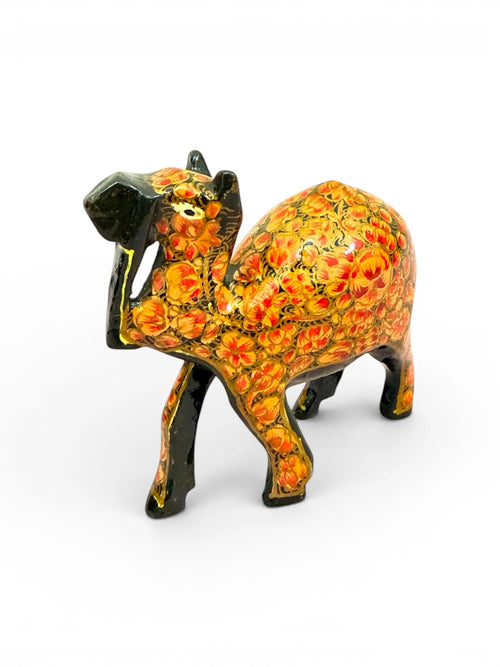 Noori Couture hand-painted papier-mâché camel figurine with intricate gold floral detailing on a rich brown base.