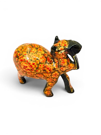 Noori Couture hand-painted papier mâché camel figurine with intricate gold and red floral detailing. Decorative collectible.