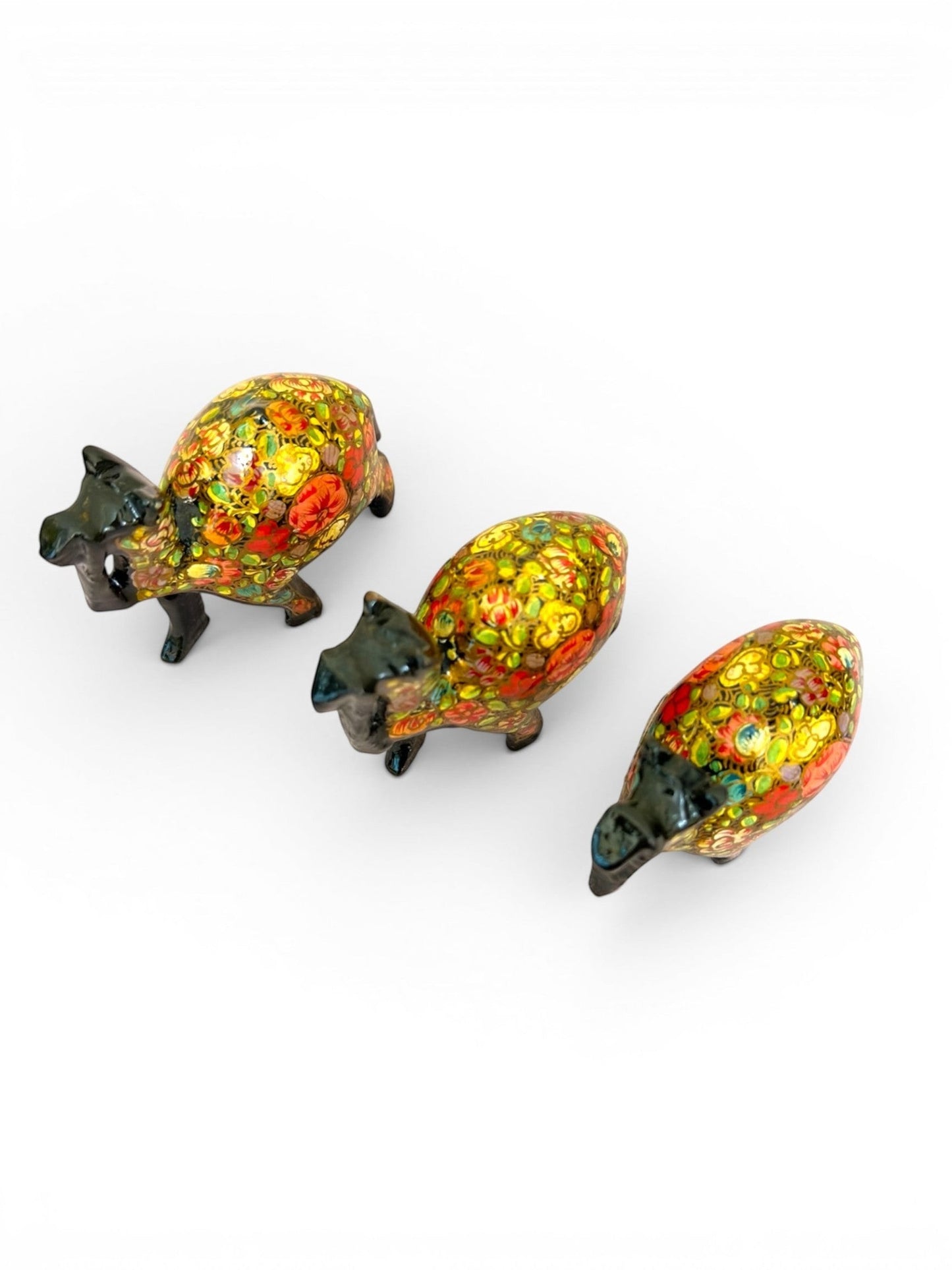 Noori Couture hand-painted camel figurines with vibrant floral patterns and glossy finish. Set of 3 decorative camels.