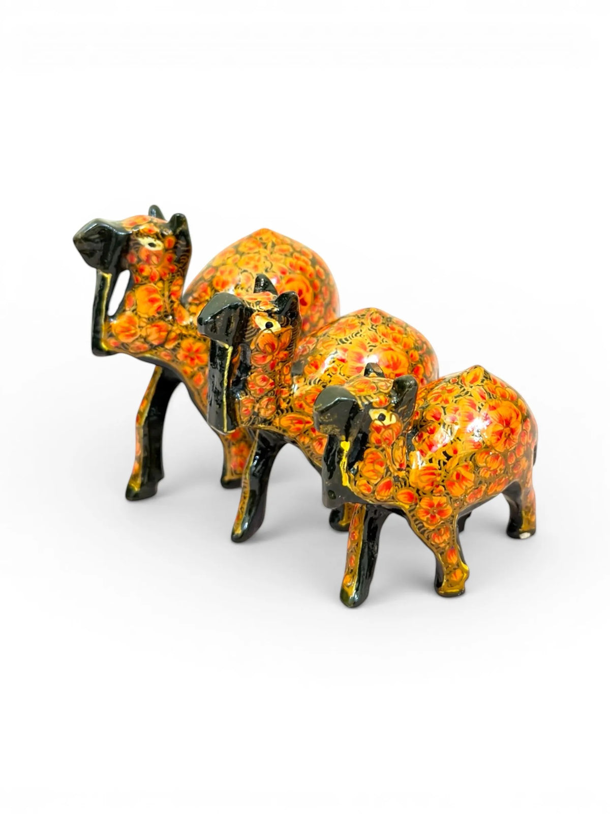 Noori Couture set of 3 hand-painted papier mâché camel figurines in rich brown with intricate gold floral detailing.