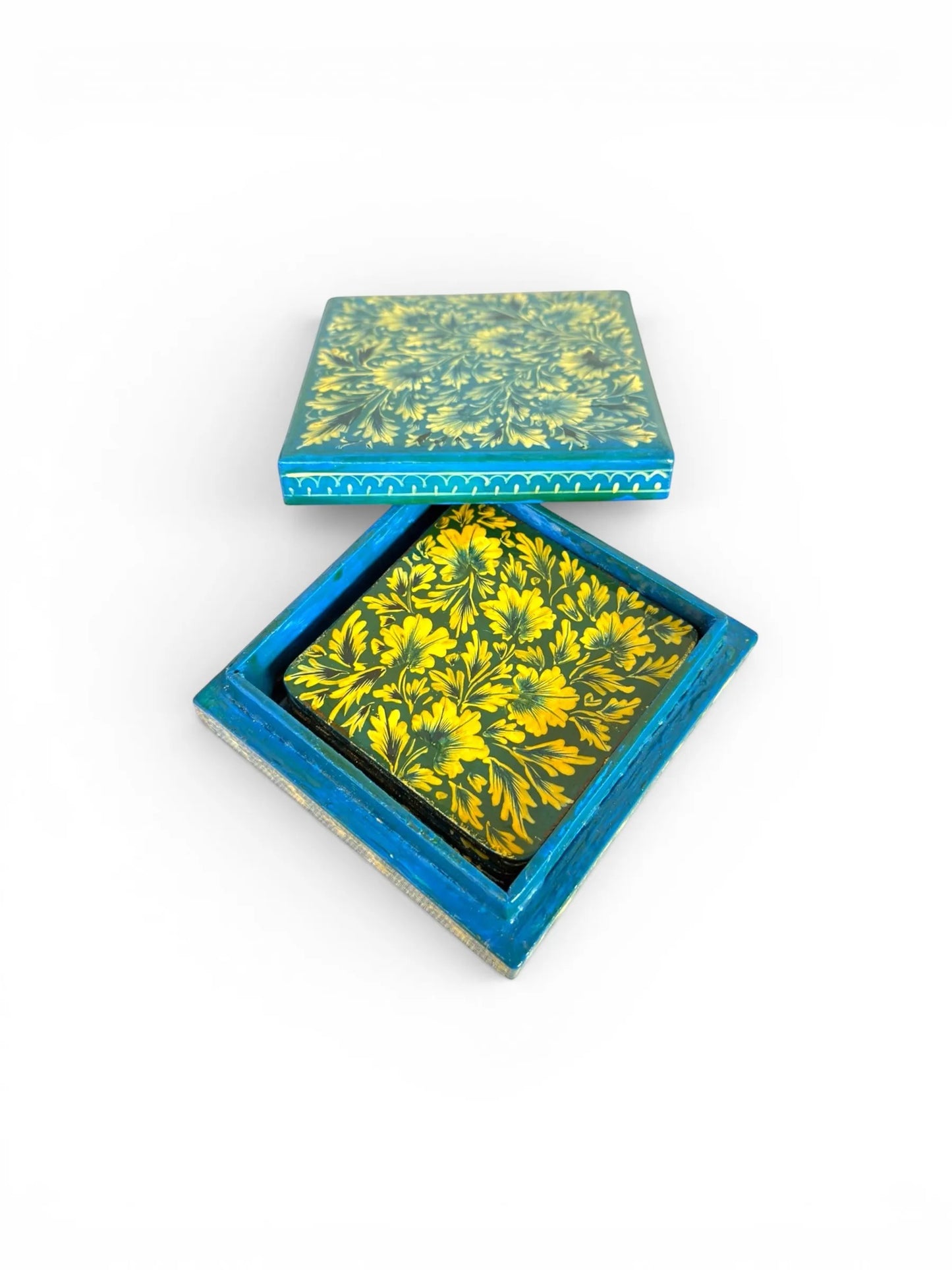 Noori Couture hand-painted papier-mâché coasters with yellow floral design on teal background, includes matching storage box.