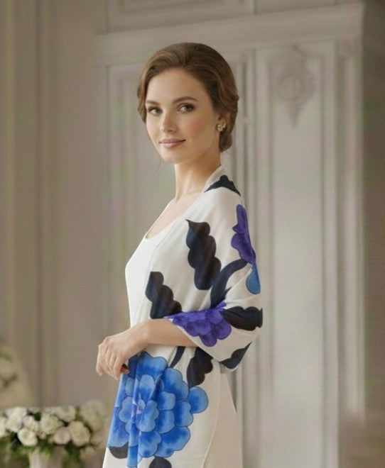 Noori Couture limited edition hand-painted shawl with blue and purple floral design on white silk fabric.