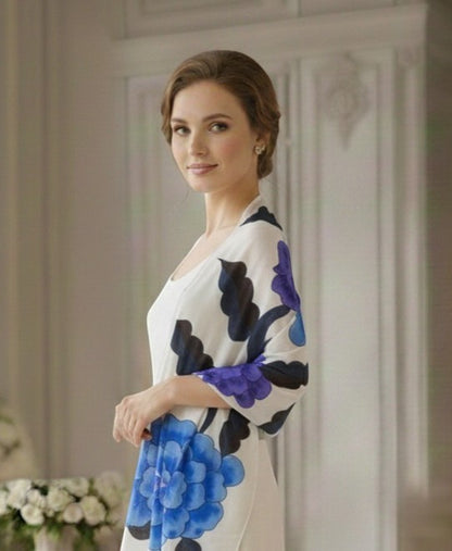 Noori Couture limited edition hand-painted shawl with blue and purple floral design on white silk fabric.