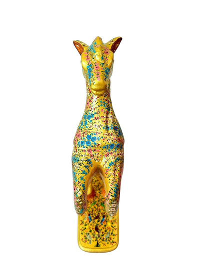 Noori Couture hand-painted paper mache horse figurine with floral design in pink and blue on gold finish, on a decorated base.