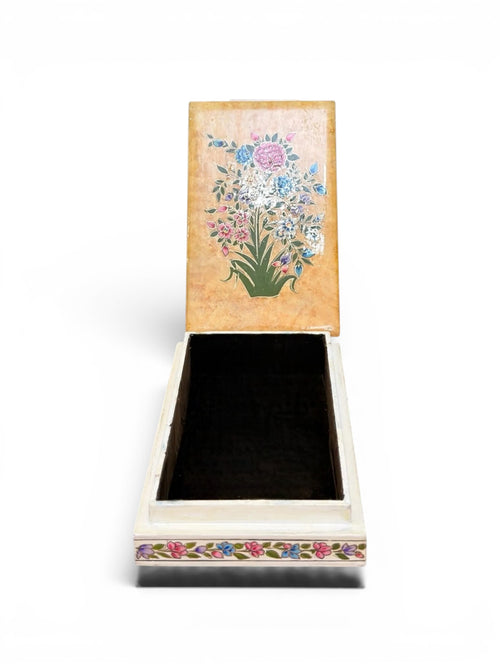 Noori Couture hand-painted papier-mâché jewellery box with floral and bird motifs. Beige lid with colourful bouquet, white base with floral trim.