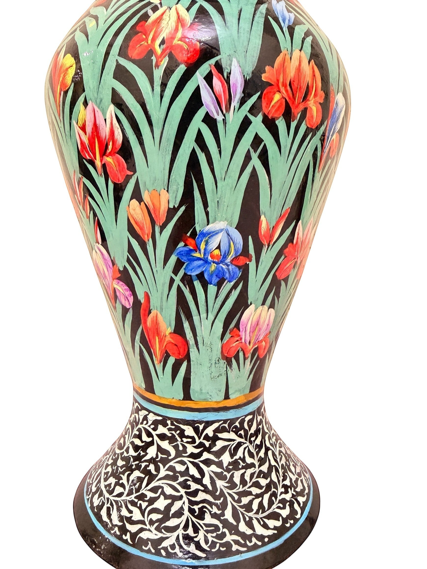 Noori Couture hand-painted paper mâché vase with green grass base, vibrant floral details, and black and white ornamental border. Limited edition art piece.