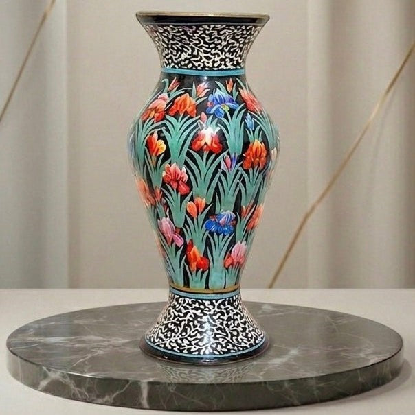 Noori Couture hand-painted paper mâché vase with green grass base, vibrant floral details, and black & white ornamental borders.